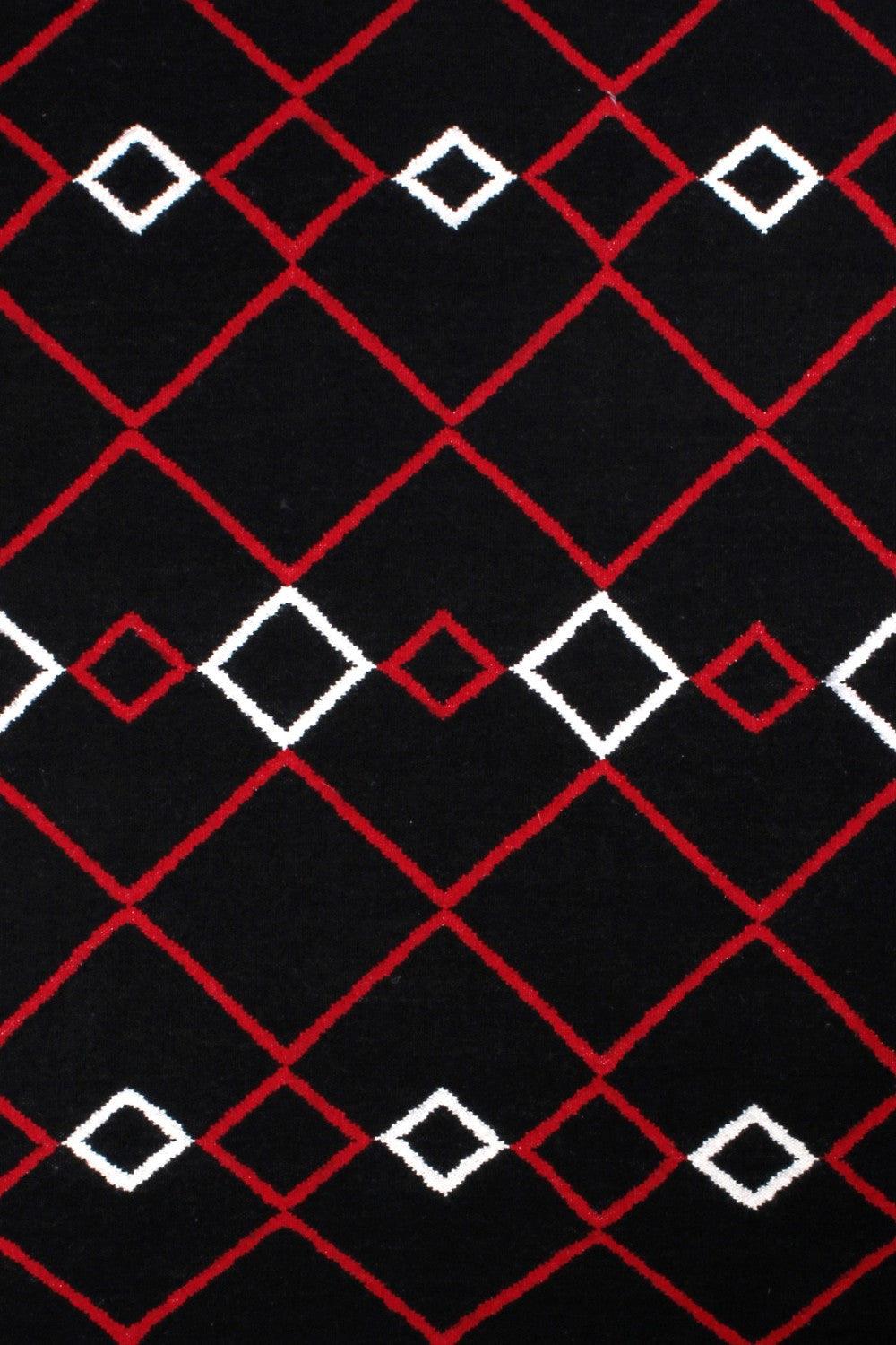 Close-up product shot of Wool Handwoven Rug Vera Red, highlighting its intricate handwoven patterns.
