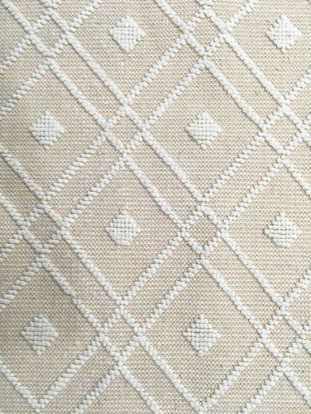 Close-up of the intricate handwoven texture on the Wool Handwoven Rug Argyle Diamond
